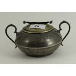 Silver coloured sugar bowl and lid