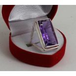 A large Silver and amethyst set ring