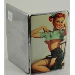 A large silver plated and enamel set cigarette case depicting a young lady partially dressed