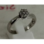 18ct white gold  ring with 7  diamonds approx 0.04ct each. Size R. Total weight: 4.8g