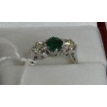 18ct white gold three stone emerald and diamond ring