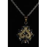 Yellow gold sapphire and diamond pendant necklace