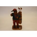 Wooden golfer figurine