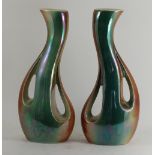 A pair of two tone vaseline glazed pierced vases