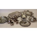 An ornate silver plate service by Webster Wilcox consisting of serving trays, a serving pan,