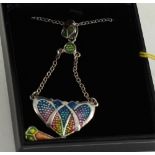 A silver art nouveau enamel set pendant