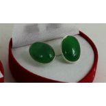 A pair of silver and jade earrings