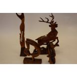 Carved wood figure of a Stag plus three other carved items