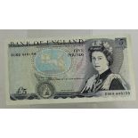 An unsigned 1980s £5 note  DU69 448199
missing cheif cashier signature