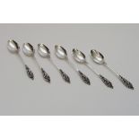 A set of 6 Hallmarked '800' silver teaspoons with ornate cast fininals.