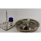 A quantity of silver plate to include salt condiment trays, napkin rings etc...