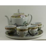 A chi famille jaune 4 piece tea set with applied mountain landscape deco,