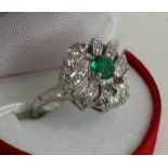 Platinum set emerald and diamond ring