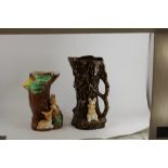 A novelty pottery vase in the form of a tree trunk and bunny and another similar