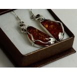 A pair of Silver and Amber earrings