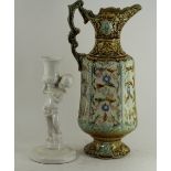 A Continental pottery ewer with ornate scrolling foliate relief deco and a continental pottery