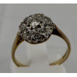 Ladies Diamond cluster ring - 8  small diamonds and 1 larger centre diamond approx. 0.2ct.