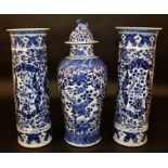 A GOOD 19TH CENTURY CHINESE BLUE & WHITE PORCELAIN GARNITURE, comprising a vase with cover and two