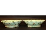 A PAIR OF 19TH CENTURY CHINESE FAMILLE ROSE CELADON-GROUND PORCELAIN BOWLS, each in the form of a