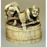 A GOOD QUALITY SIGNED JAPANESE MEIJI PERIOD IVORY OKIMONO OF TWO BARREL MAKERS, energetically