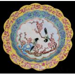 A CHINESE CANTON ENAMEL BOWL, with a wavy rim, the interior decorated with a pair of birds on a