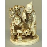 A GOOD SIGNED JAPANESE MEIJI PERIOD IVORY OKIMONO OF TWO MONKEY PERFORMERS, one crouching and with a