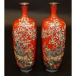 A GOOD PAIR OF JAPANESE MEIJI PERIOD RED-GROUND SILVER WIRE CLOISONNE VASES, each square-section