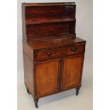 A REGENCY MAHOGANY BOOKCASE with single drawer on a base with sliding secretaire drawer, panel doors