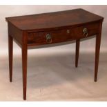 A GEORGE III MAHOGANY BOWFRONTED SIDE TABLE with a single frieze drawer having lion mask handles,