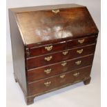 A GEORGE III MAHOGANY BUREAU, with fall front, fitted interior over two short and three long drawers