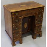 A SMALL GEORGIAN MAHOGANY INLAID KNEEHOLE DESK with satinwood inlay, single frieze drawer over a