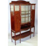 AN EDWARDIAN MAHOGANY STANDING CORNER DISPLAY CABINET, with galleried back, central square