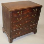 A GEORGE III MAHOGANY STRAIGHT FRONT CHEST of four long graduated drawers with brass handles