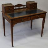 A VICTORIAN ROSEWOOD WRITING DESK, the top with a pair of small drawers either side, leather writing