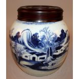 AN 18TH/19TH CENTURY CHINESE BLUE & WHITE PROVINCIAL PORCELAIN JAR, with replacement wood cover, the