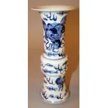 A 19TH CENTURY CHINESE BLUE & WHITE PORCELAIN GU VASE, painted with buddhistic lions amidst flame