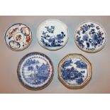 A GROUP OF FOUR 18TH CENTURY CHINESE PORCELAIN SAUCERS, variously decorated, the largest 4.8in wide;