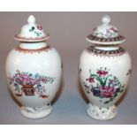 TWO 18TH CENTURY CHINESE FAMILLE ROSE PORCELAIN TEA CADDIES & COVERS, each painted with floral