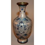 AN EARLY 20TH CENTURY WHITE-GROUND CHINESE CLOISONNE VASE, decorated with formal leafage reserved on