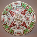 AN UNUSUAL 18TH CENTURY CHINESE CLOBBERED PLATE, painted in European enamels and gilding with