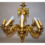 AN IMPOSING GILT BRONZE EIGHT BRANCH CHANDELIER, with urn shaped upper section, surmounted by