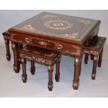 A CHINESE ROSEWOOD AND IVORY INLAID LOW OCCASIONAL TABLE with four matching small tables.2ft 6ins