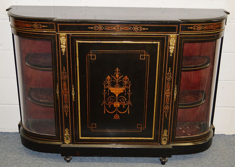 A VICTORIAN EBONISED AND INLAID CREDENZA, the central door flanked by a pair of glazed bowfronted