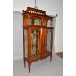 A LIBERTY & CO MAHOGANY INLAID CHINA CABINET, the top with pierced frieze, mirror back and turned