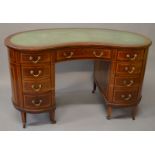 AN EDWARDIAN MAHOGANY KIDNEY SHAPE PEDESTAL DESK, the green leatherette inset writing surface