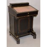 A VICTORIAN EBONISED AND LINE INLAID DAVENPORT with upper stationary compartment, leather inset