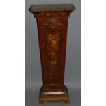 A FRENCH INLAID TORCHERE inlaid with musical trophies, garlands etc with ormolu mounts.Bears