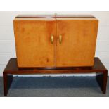 A FRENCH ROSEWOOD COCKTAIL CABINET, CIRCA. 1950, the pair of leather covered doors opening to reveal