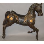 A LARGE CARVED AND PAINTED WOOD MODEL OF A HORSE.4ft 0ins long x 3ft 9ins high.