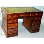 A GEORGIAN MAHOGANY PEDESTAL DESK with inset leather top, green leather writing panel, three